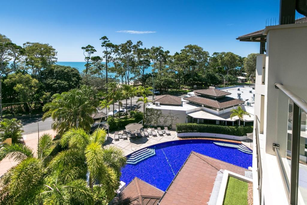 an aerial view of a resort with a swimming pool at Grand Mercure Allegra Hervey Bay in Hervey Bay