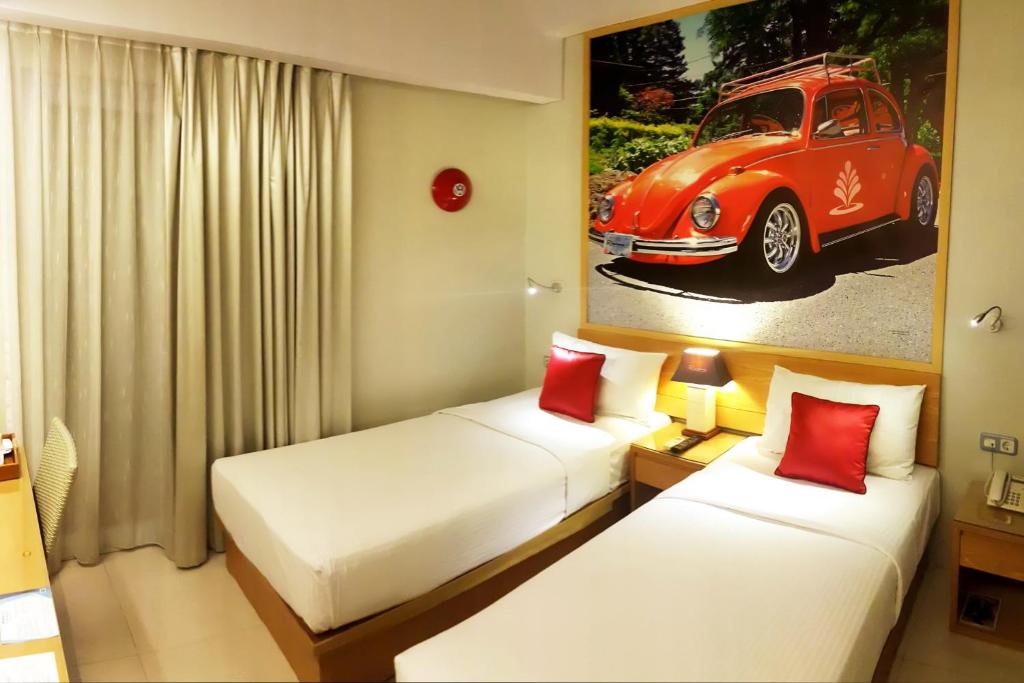 Postel nebo postele na pokoji v ubytování Rhadana Hotel