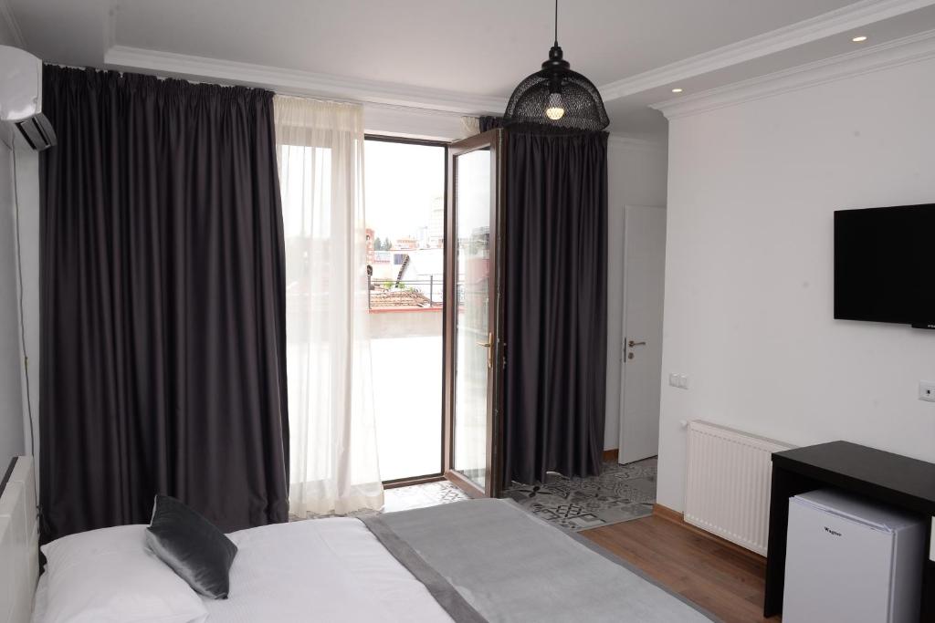 Postel nebo postele na pokoji v ubytování Guest House Gantiadi