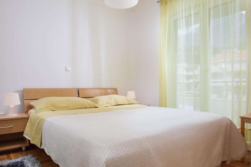 Postel nebo postele na pokoji v ubytování Apartments Ivandić