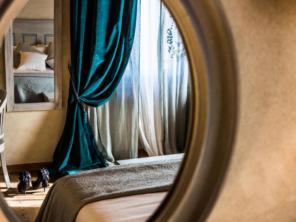Postel nebo postele na pokoji v ubytování Alice Relais Nelle Vigne