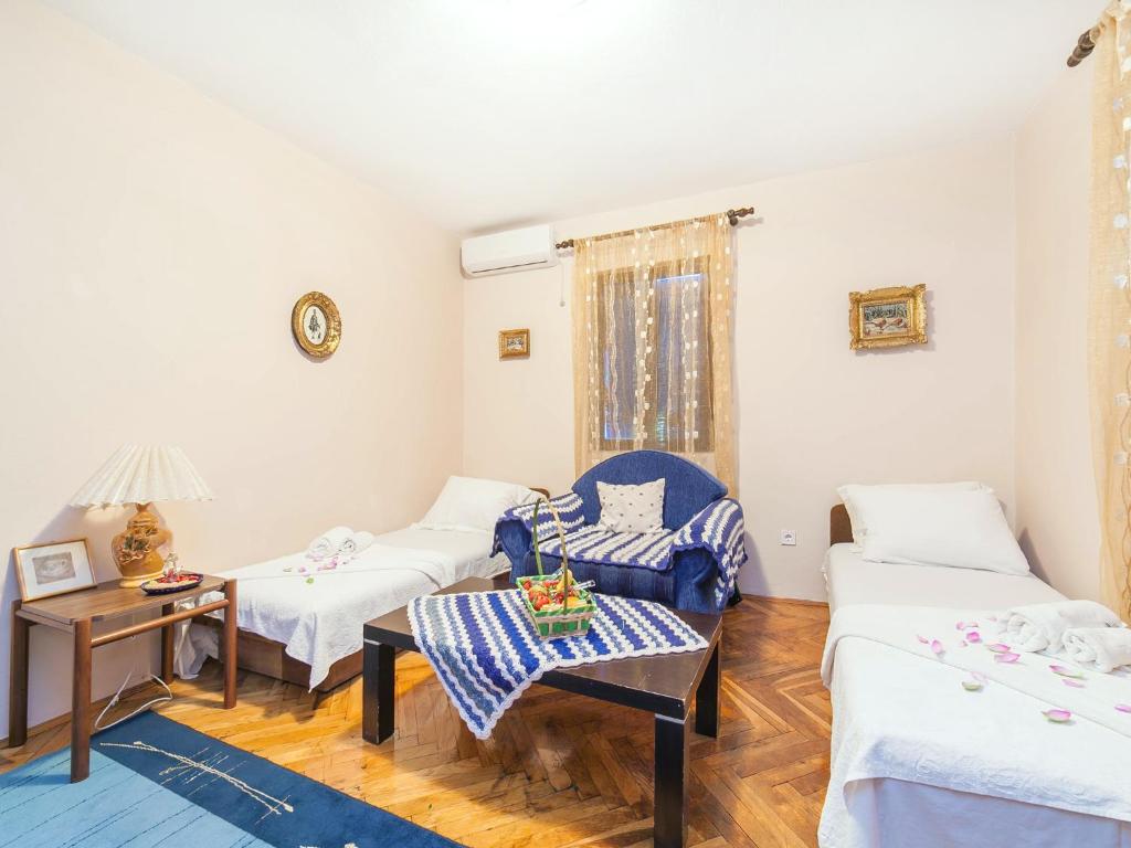 Postel nebo postele na pokoji v ubytování Holiday House Stari Volat