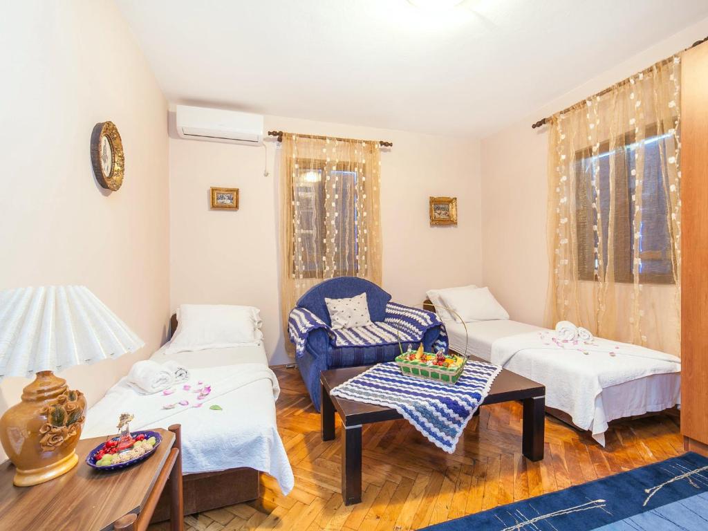 Postel nebo postele na pokoji v ubytování Holiday House Stari Volat