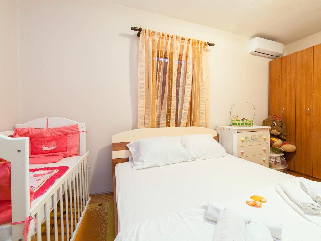 Postel nebo postele na pokoji v ubytování Holiday House Stari Volat