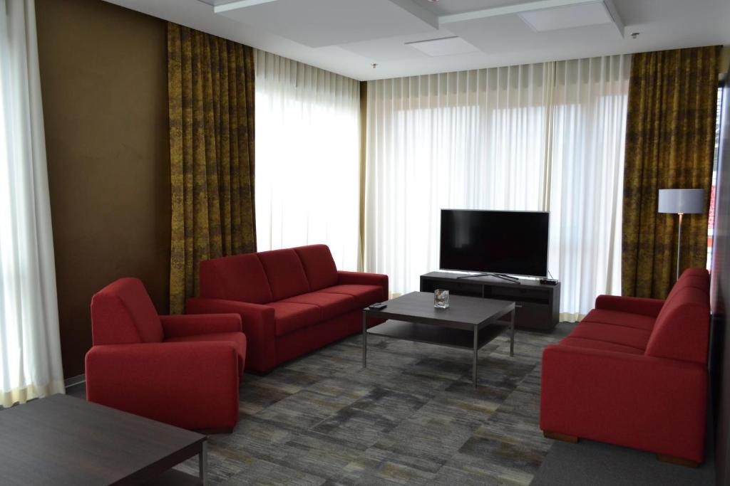 TV a/nebo společenská místnost v ubytování Hotel Arena