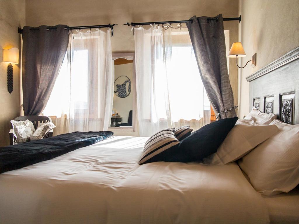 Postel nebo postele na pokoji v ubytování Alice Relais Nelle Vigne