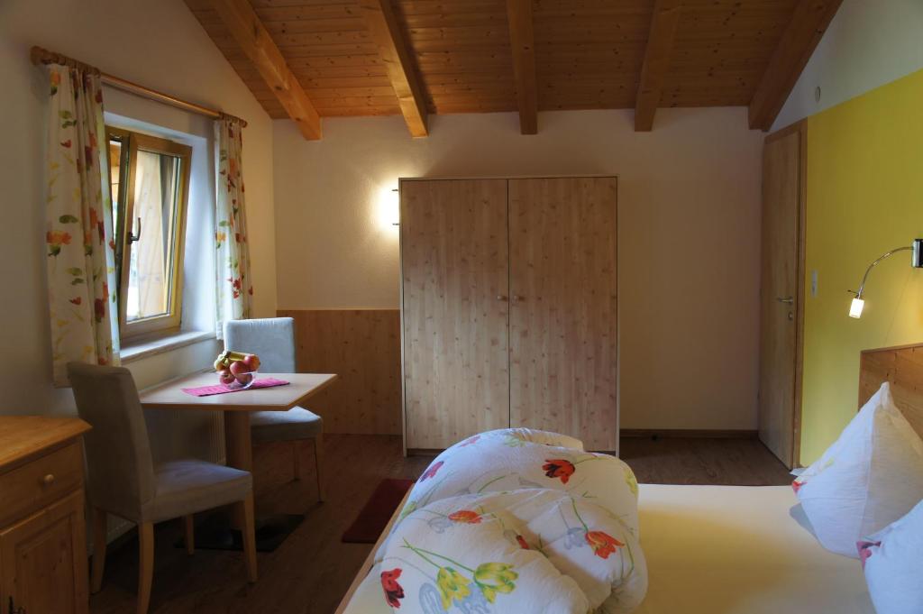 Postel nebo postele na pokoji v ubytování Alpenecho
