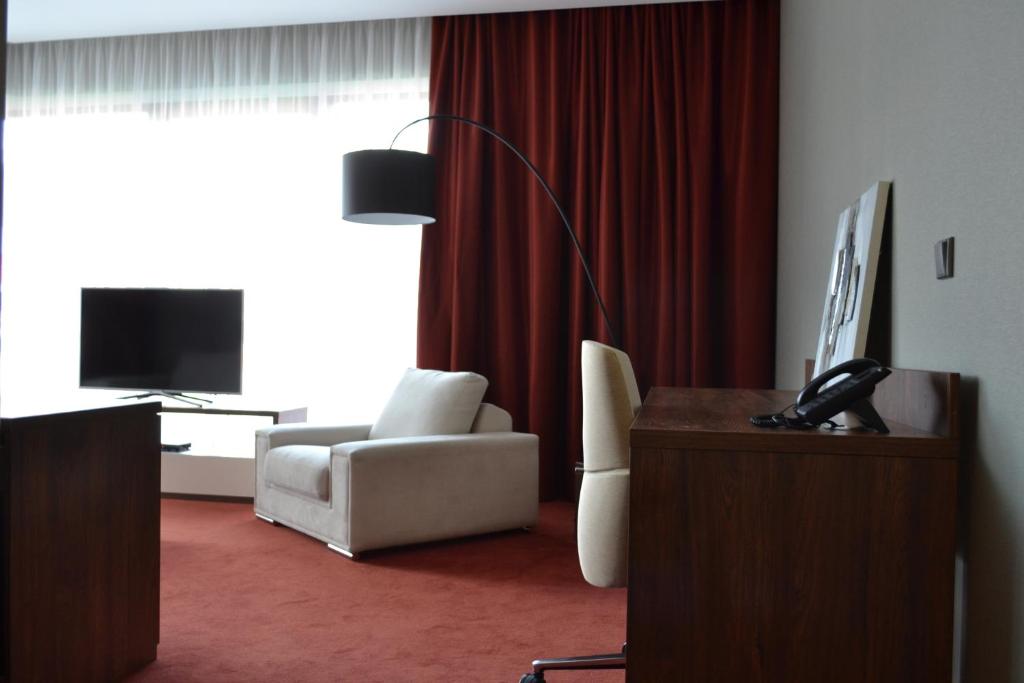TV a/nebo společenská místnost v ubytování Hotel Arena