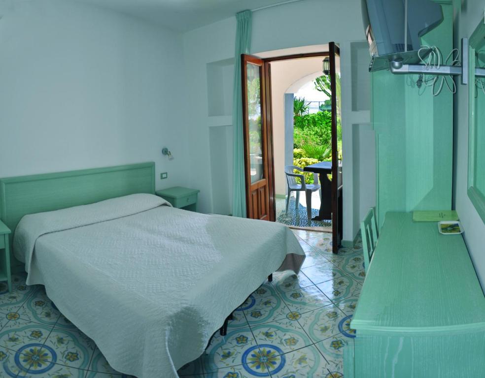 Postel nebo postele na pokoji v ubytování Hotel CASA LA VIGNA