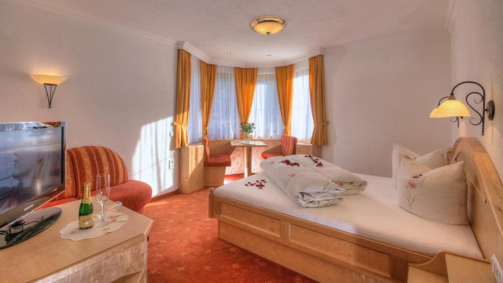 TV a/nebo společenská místnost v ubytování Hotel-Garni Weidacherhof