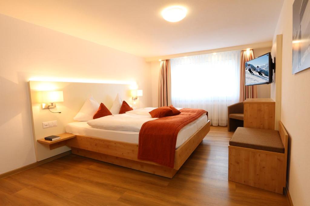 Postel nebo postele na pokoji v ubytování Lifestyle & Spa Hotel Grächerhof