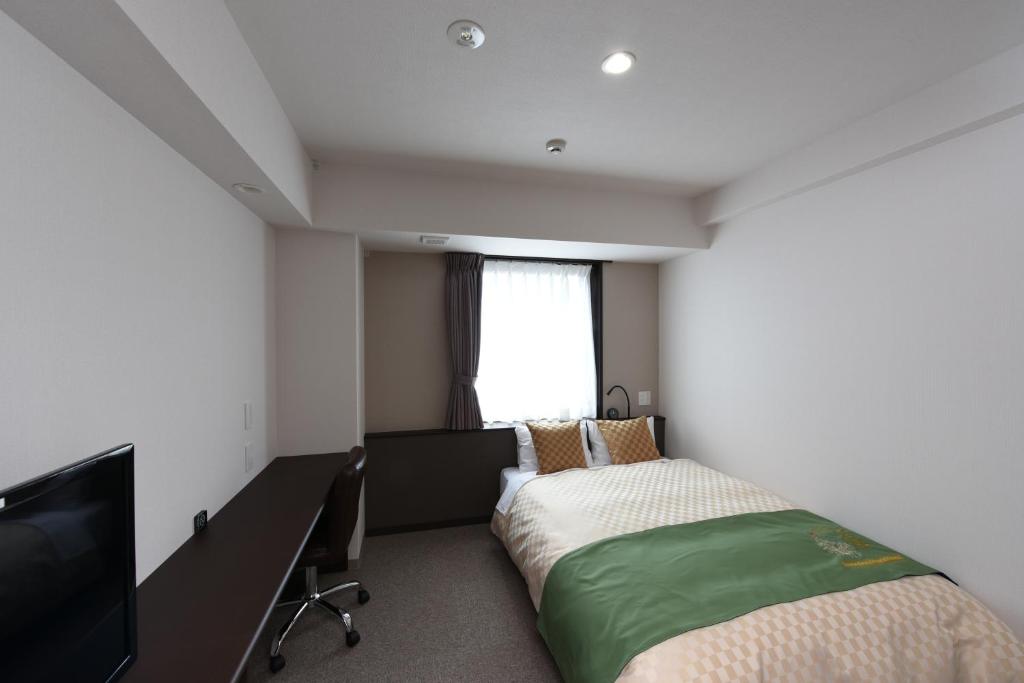 Postel nebo postele na pokoji v ubytování Hotel Showmeikan