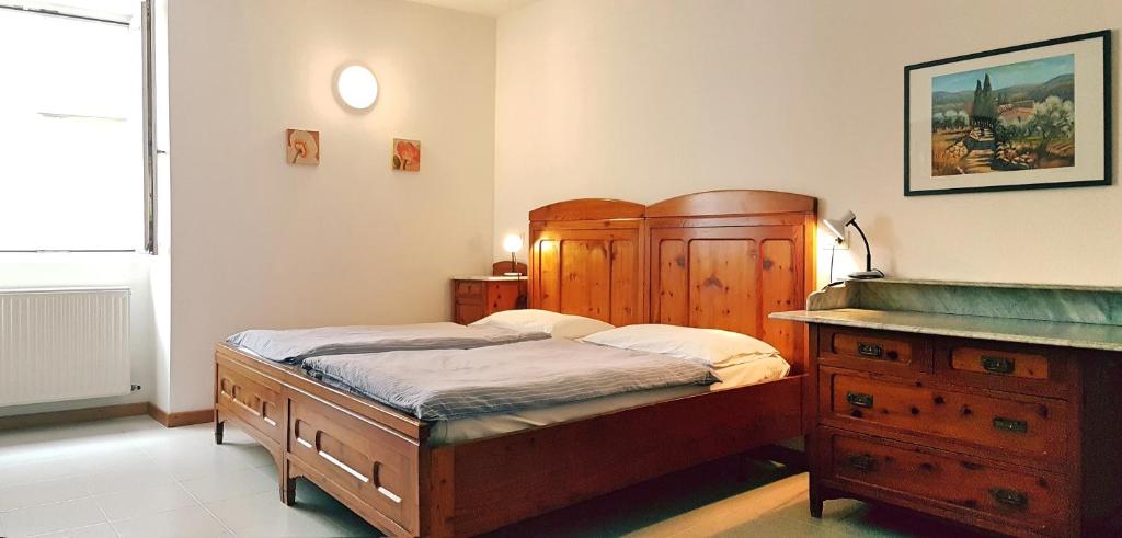 سرير أو أسرّة في غرفة في Casa Sandra Bertolini Appartamenti