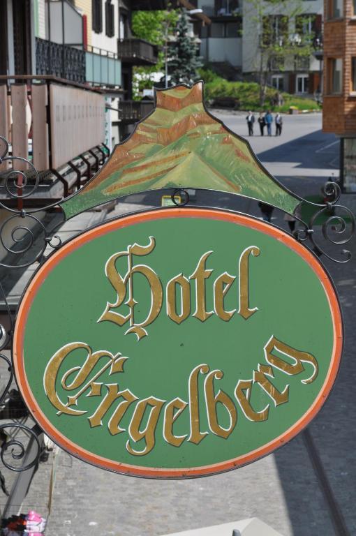 a sign for a buddha shop on a street at Hotel Engelberg "mein Trail Hotel" in Engelberg