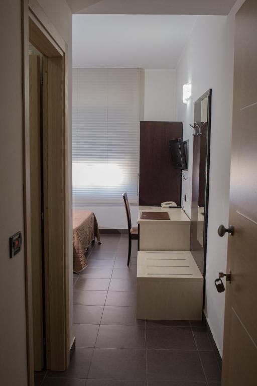 Postel nebo postele na pokoji v ubytování Pansini Hotel Residence