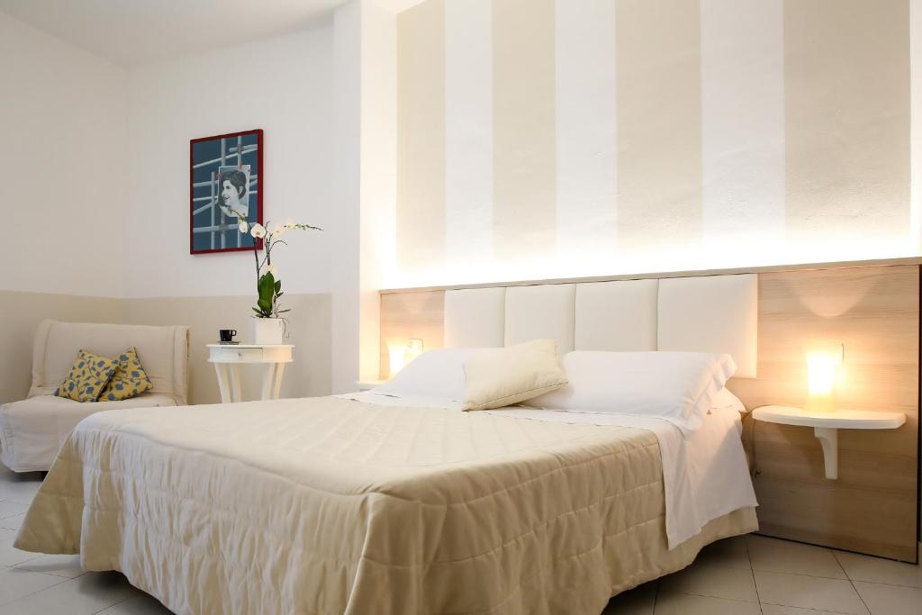 Кровать или кровати в номере Hotel Rosmarina