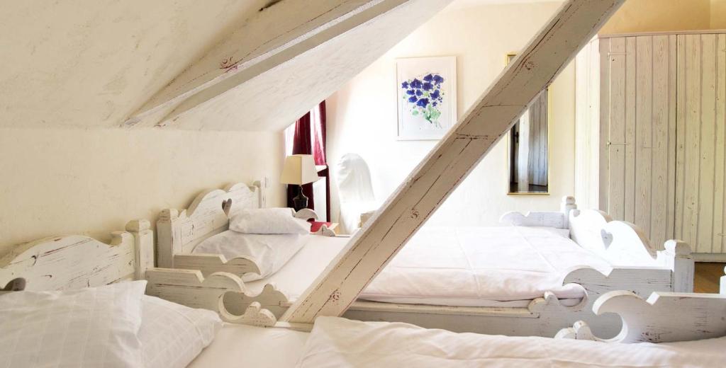 Postel nebo postele na pokoji v ubytování Hotel Der Grischäfer