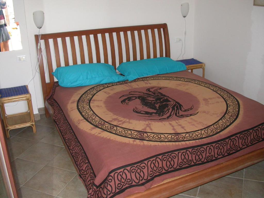 a bed with a dragon design on it at Stella Marina in Valledoria