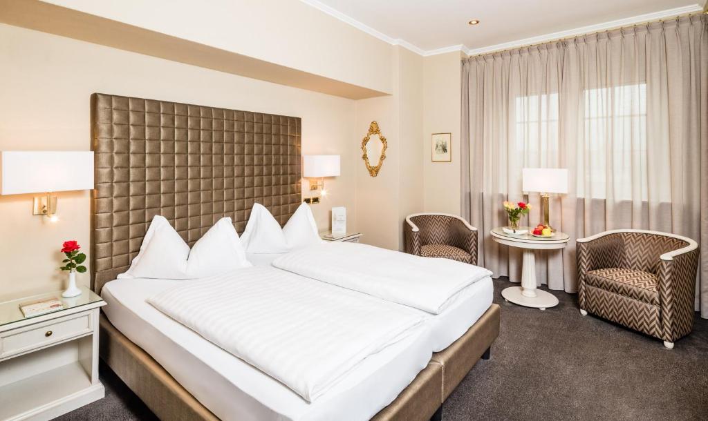 Postel nebo postele na pokoji v ubytování Classic Hotel Meranerhof