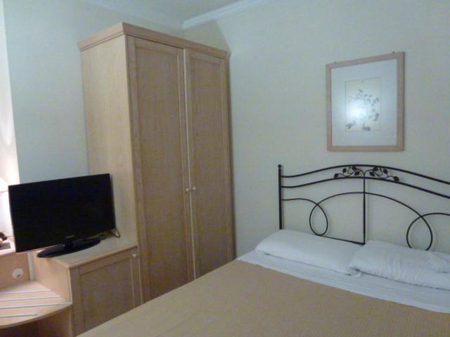 Postel nebo postele na pokoji v ubytování Hotel Sirolo