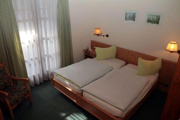 Postel nebo postele na pokoji v ubytování Hotel et Spa du Scharrach