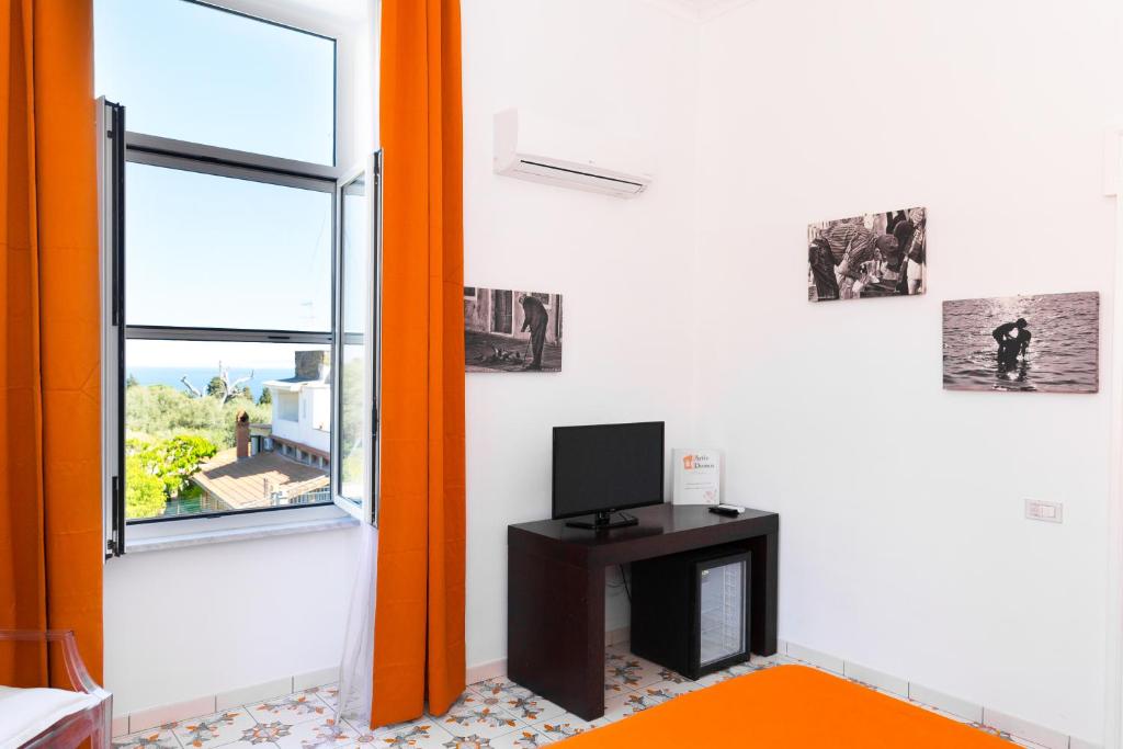 TV a/nebo společenská místnost v ubytování Artis Domus Relais & Spa