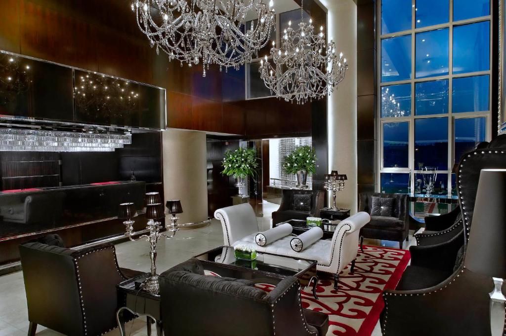 a living room with a chandelier and a lobby at Sun City Hotel - The Gabriel in Cairo