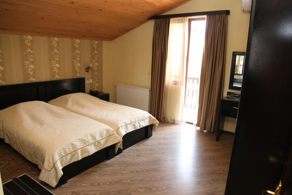 Postel nebo postele na pokoji v ubytování Hotel Obola