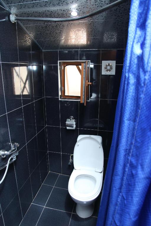 Koupelna v ubytování Hotel Obola