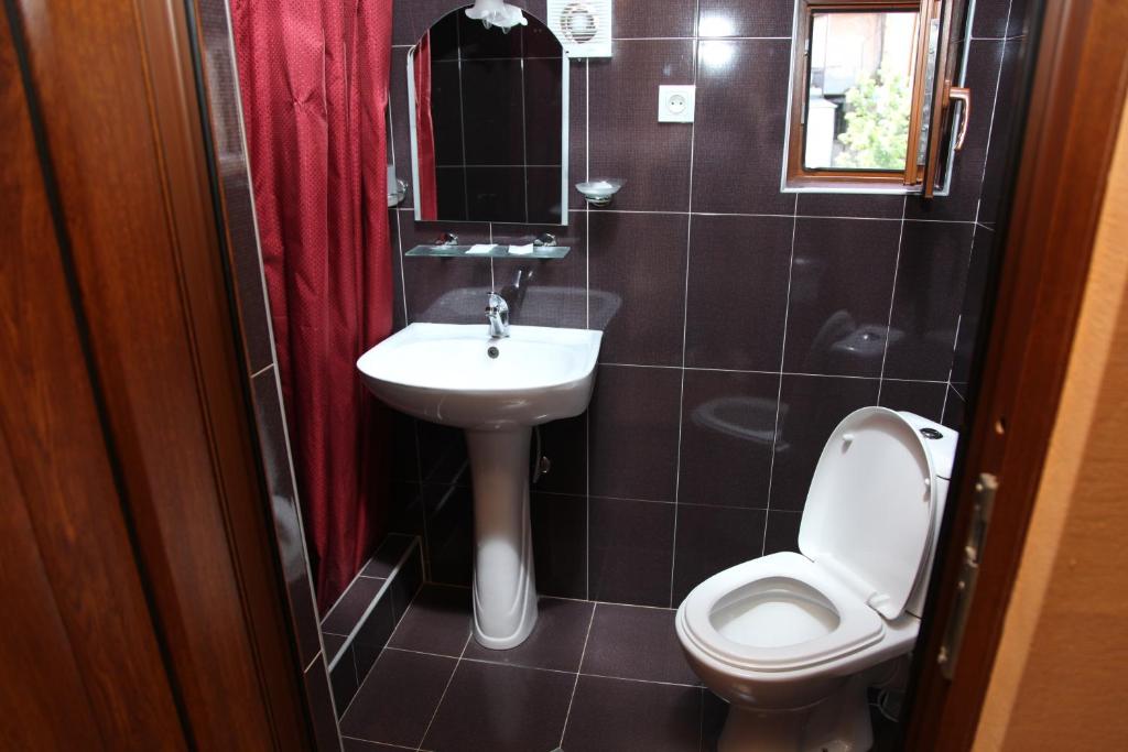 Koupelna v ubytování Hotel Obola