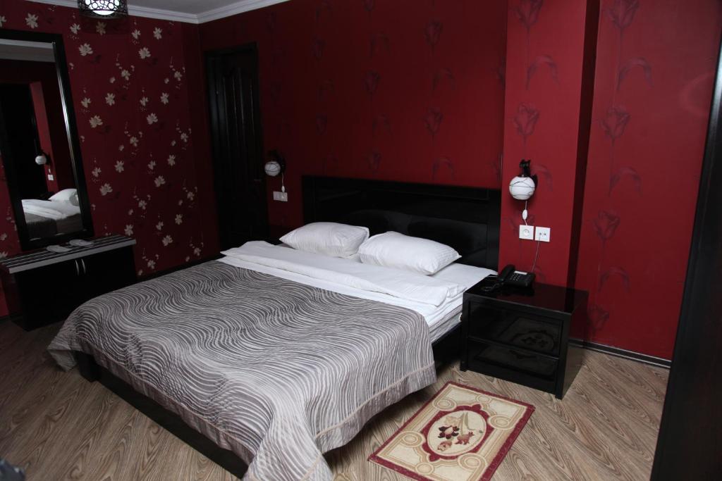 Postel nebo postele na pokoji v ubytování Hotel Obola