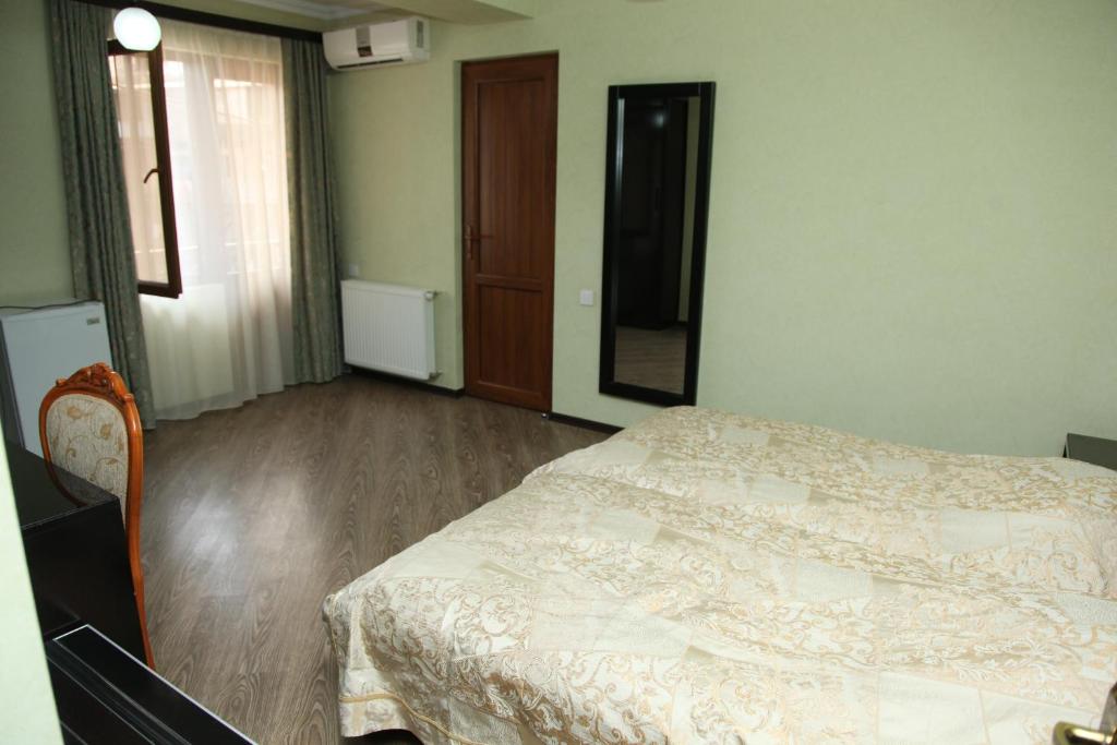Postel nebo postele na pokoji v ubytování Hotel Obola