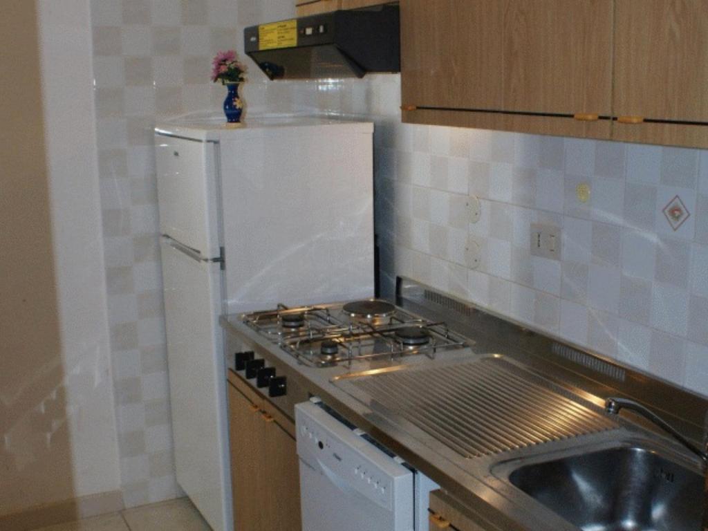 A kitchen or kitchenette at Lignano Pineta with air conditioning&washing machine