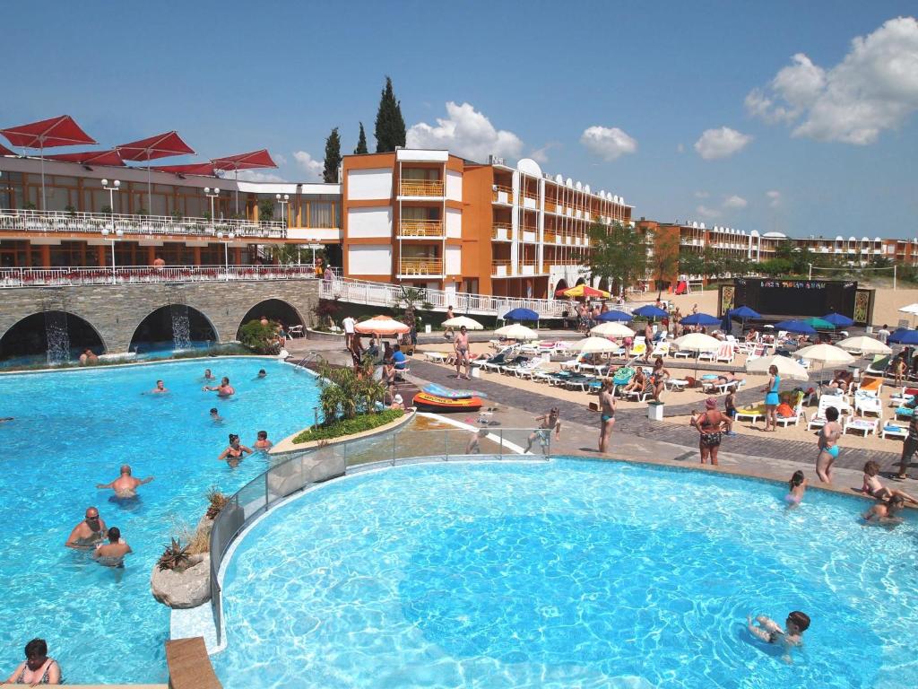 a group of people in a large swimming pool at Nessebar Beach Hotel in Sunny Beach