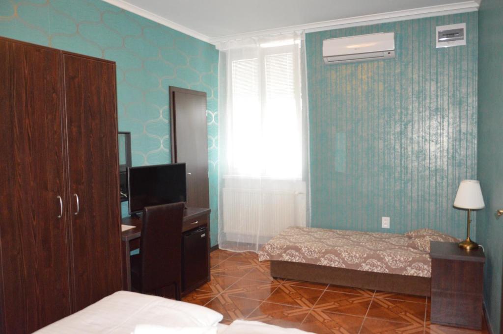 Postel nebo postele na pokoji v ubytování LAS PALMAS ROOMS
