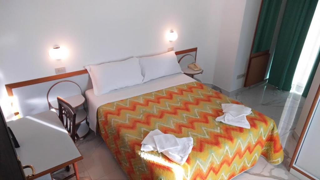 Postel nebo postele na pokoji v ubytování Hotel Memory