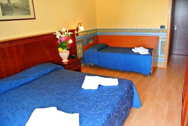 Postel nebo postele na pokoji v ubytování Hotel Mirage