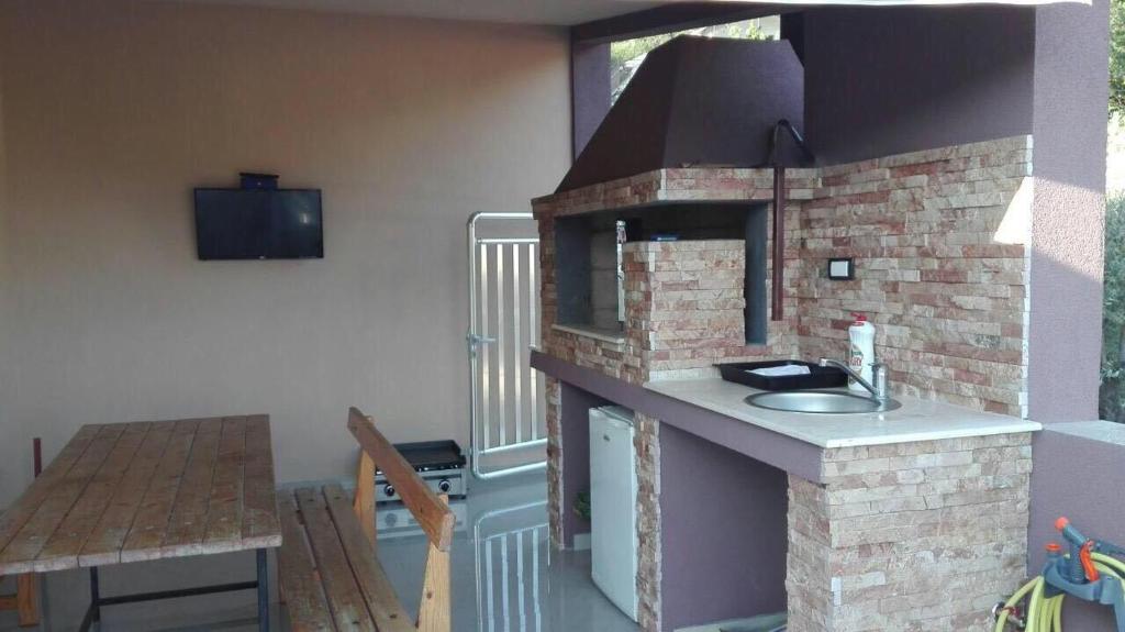 Kuchyň nebo kuchyňský kout v ubytování Vip Apartmani Canj
