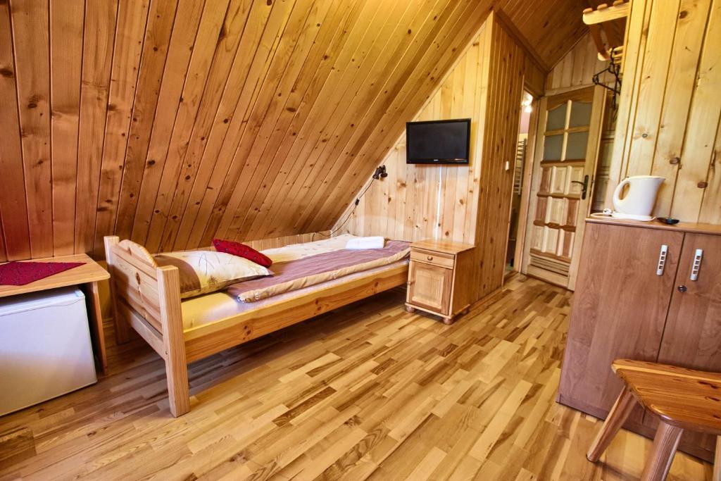 Televízia a/alebo spoločenská miestnosť v ubytovaní Pokoje Gościnne Za Wnukiem
