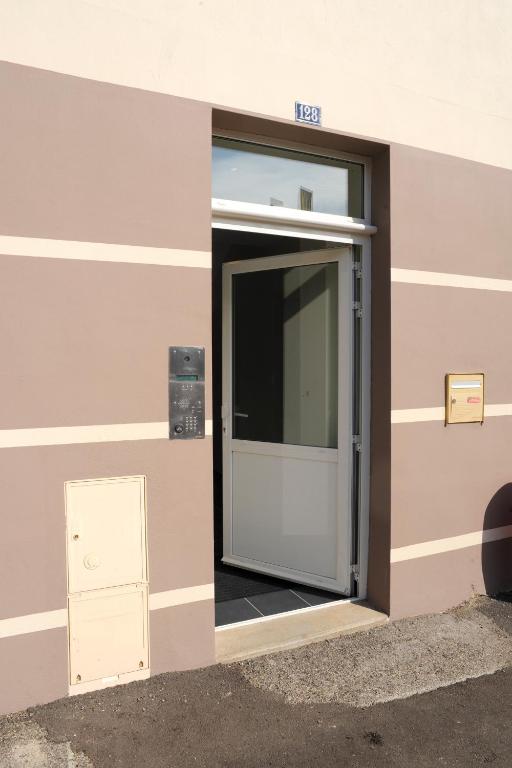 an entrance to a building with a door at Aux Jardins de L&#39;Isle in Vienne
