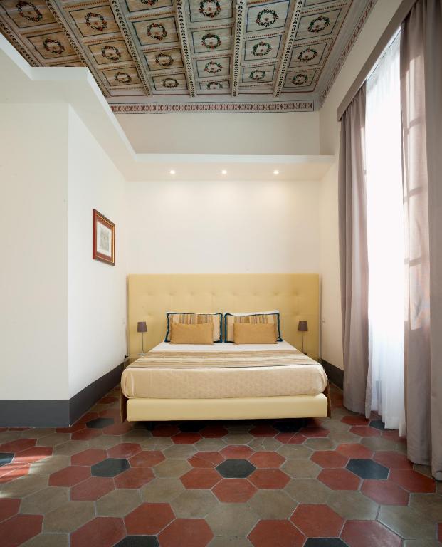 Postel nebo postele na pokoji v ubytování Antico Angelo - Residenza d'Epoca