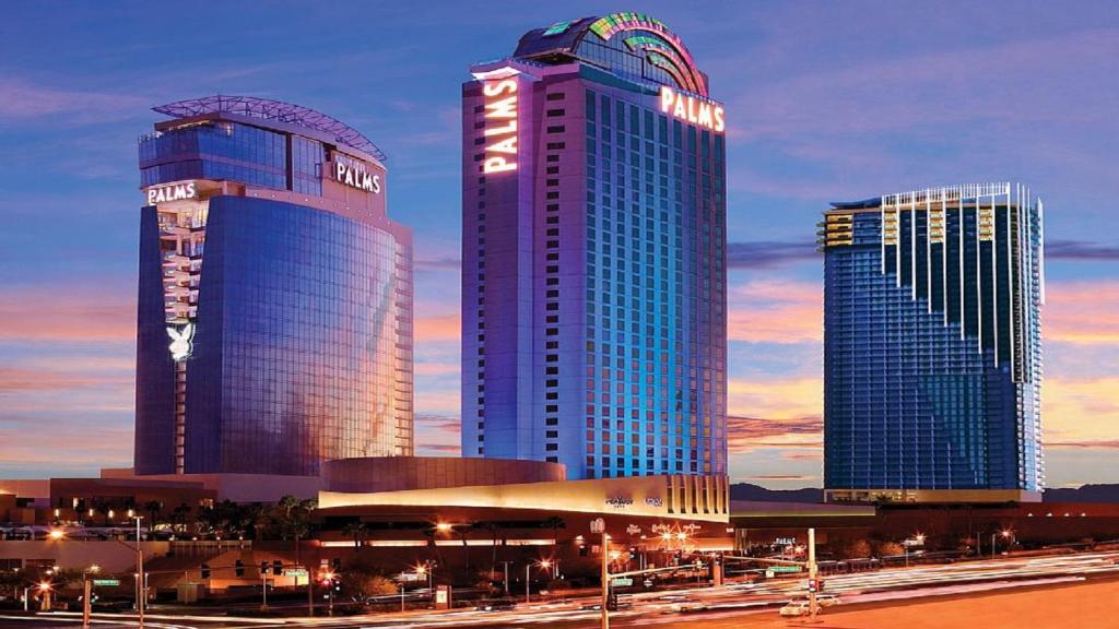 three tall buildings in a city at night at Palms Place Las Vegas Strip View Studio Suite 22 in Las Vegas