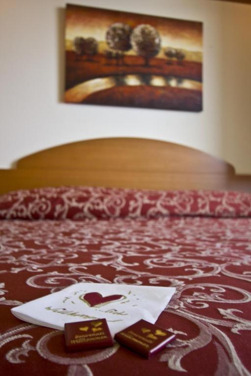 Postel nebo postele na pokoji v ubytování Hotel Palm Beach B&B SEA VIEW