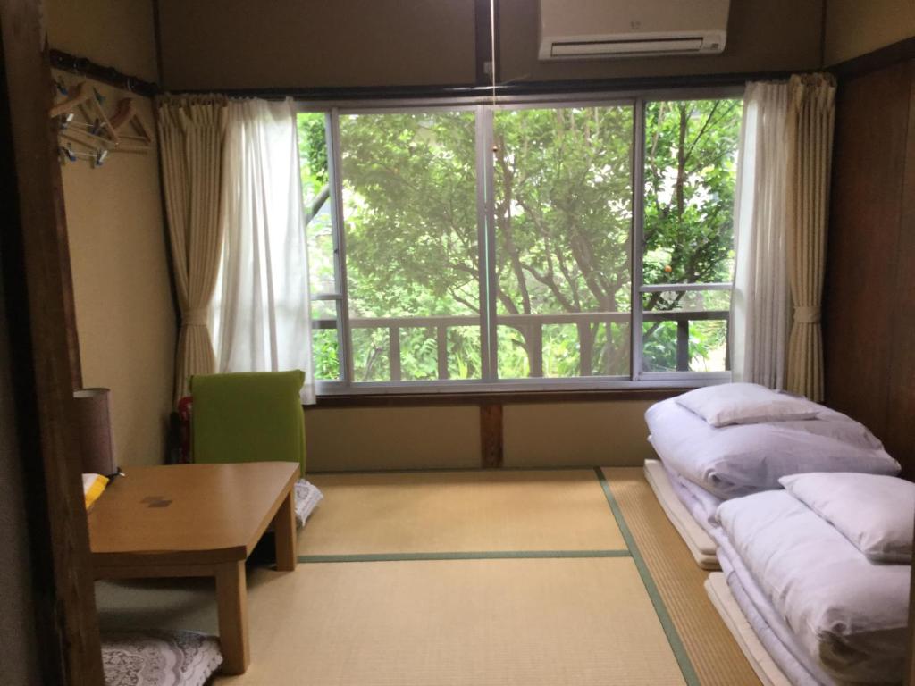 Letto o letti in una camera di Guesthouse Tamura