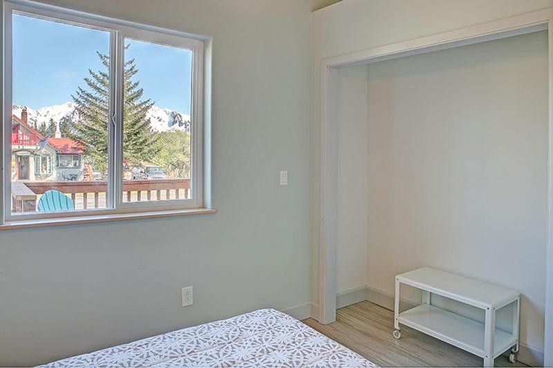 a bedroom with a bed and a window with a view at The Vue B&B in Seward