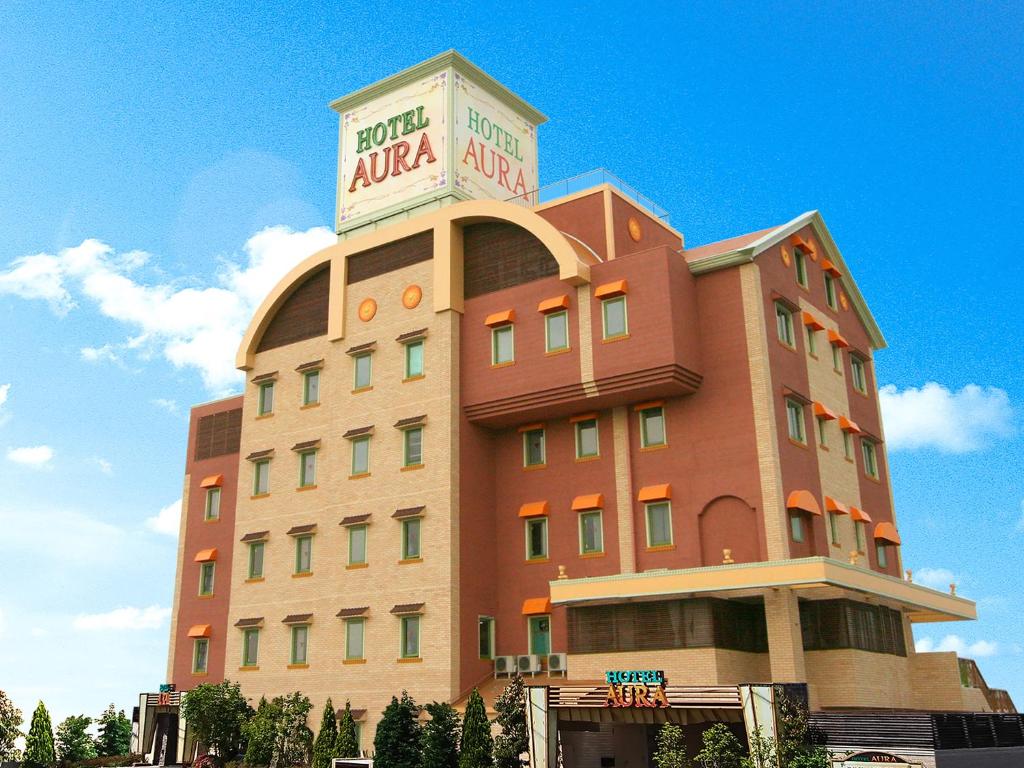 un bâtiment avec un panneau d'aria en haut dans l'établissement Aura Kanku (Adult Only), à Sennan