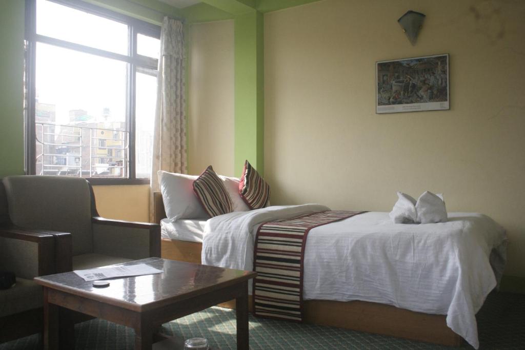 Postel nebo postele na pokoji v ubytování Hotel Yala Peak