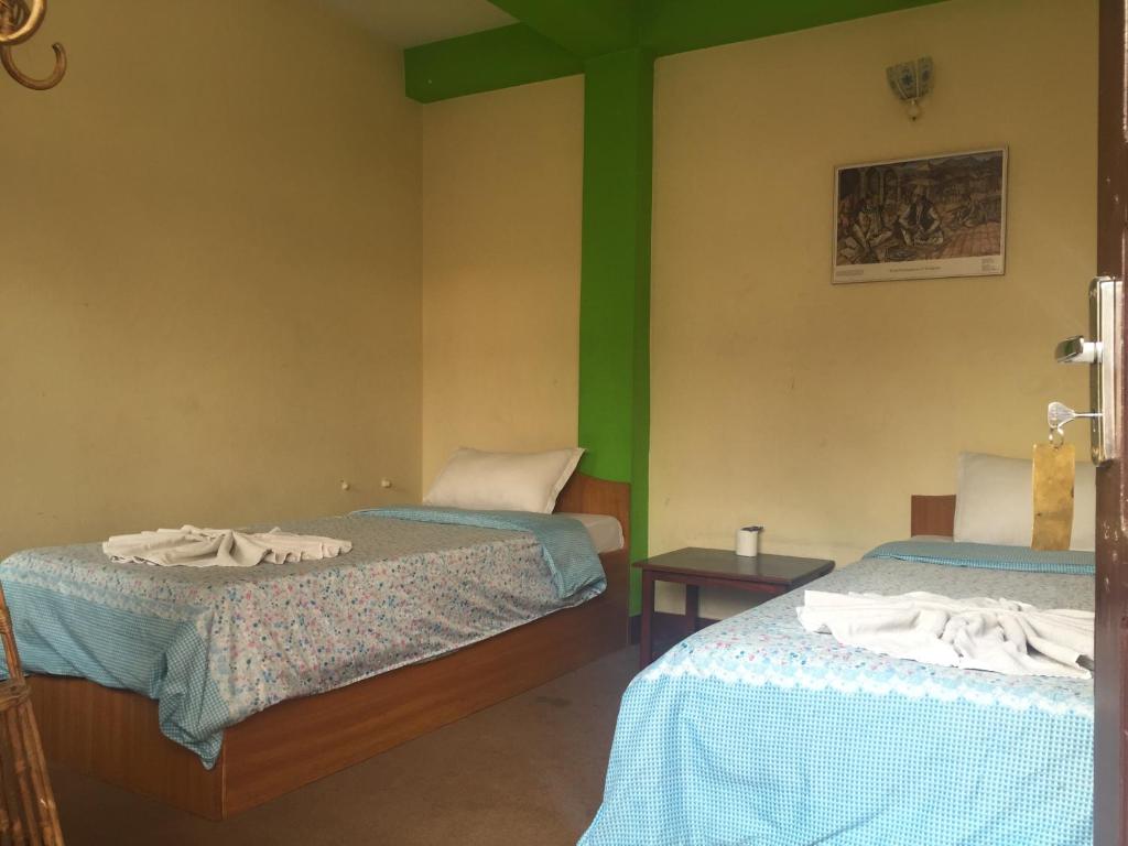 Postel nebo postele na pokoji v ubytování Hotel Yala Peak
