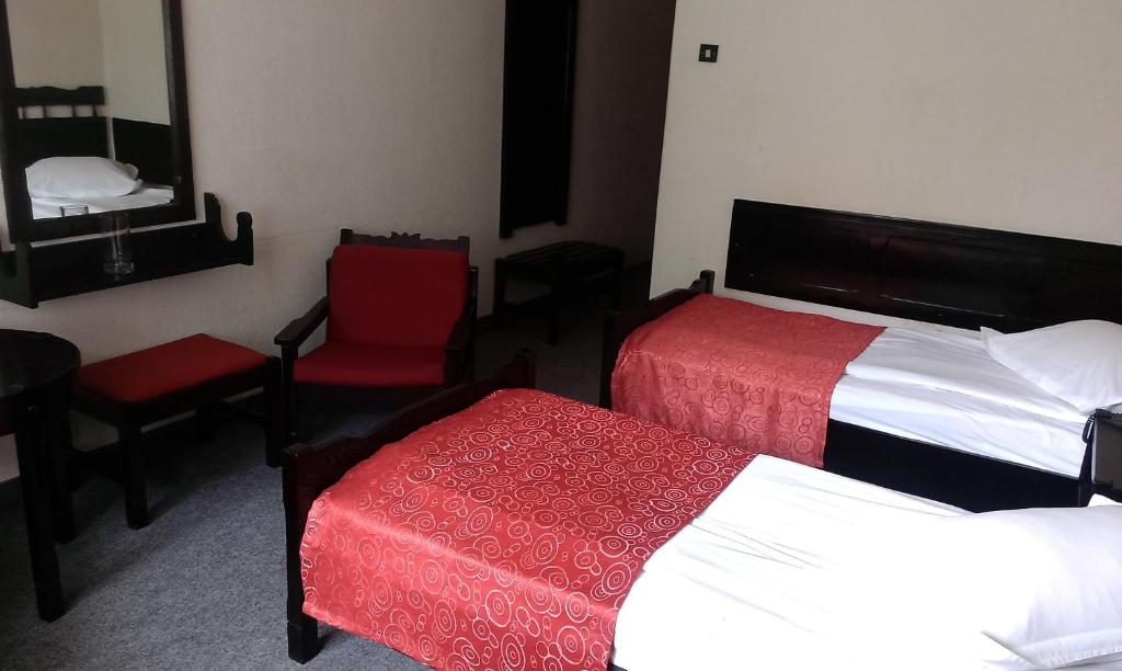 Postel nebo postele na pokoji v ubytování Hotel Tusnad