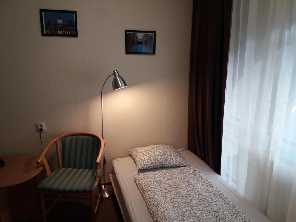 Postel nebo postele na pokoji v ubytování Mezzo Budapest